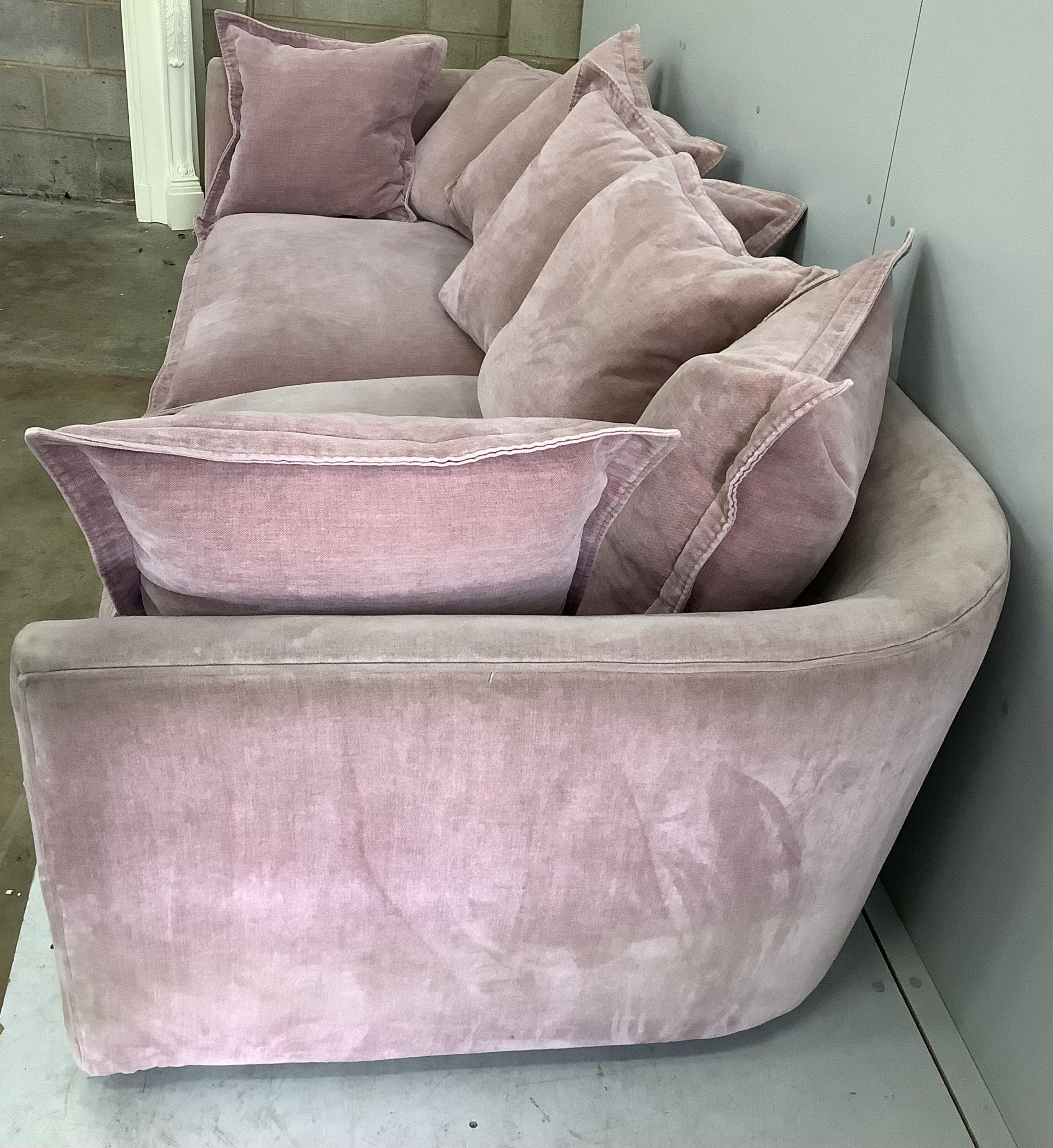 A Contemporary Sofology salmon pink sofa, width 275cm, depth 100cm, height 71cm. Condition - fair